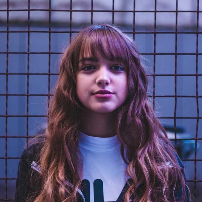 Artistic black and white circular photograph showing abstract dance poses and motion
